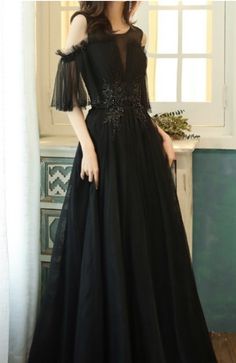 $109.90 Black Cold Shoulder Princess Evening Dress. This gown is made of a thick fabric. It is will make you look very elegant and feminine. This gown is perfect for balls and formal evenings. It will show your feminity and elegance. It is good for elegant ladies and seductive women. Black A-line Ball Gown For Formal Events, Black A-line Ball Gown For Formal Occasions, Elegant Black A-line Ball Gown, Black Gown For Banquet During Prom Season, Black Ball Gown For Party, Black V-neck Gown For Banquet, Black Floor-length Prom Dress, Elegant Black Ball Gown For Prom, Black Floor-length Ball Gown For Evening