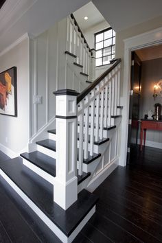 a white and black staircase in a house