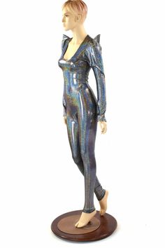 "This item is made to order, please read all the way through the listing before purchasing! This bodysuit is made of lycra spandex in a dazzlingly reflective holographic . It shines and sparkles with every move you make! Sharp shoulder sleeves, just step in and pull it up over your shoulders to put it on. Four way stretch for a figure forming fit. This bodysuit is unlined. Inseam: 32\" Womens Sizing (See below for instructions on where measurements should be taken) XXS: Bust 29\"-30\" / Waist 22 Futuristic Stretch Bodysuit For Costume Party, Fitted Rave Unitard For Cosplay, Metallic Shiny High Stretch Unitard, Fitted Rave Bodysuit For Costume Party, Fitted Metallic Shiny Bodysuit, Metallic Shiny Fitted Bodysuit, Fitted Rave Unitard For Costume Party, Disco Metallic Bodysuit For Club, Metallic Stretch Bodysuit For Club