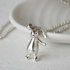 This very special bunny rabbit necklace was inspired by our little boy's best friend, his faithful floppy bunny, much loved and never far from his side. This little chap was hand carved from wax before being cast in sterling silver. Hanging gracefully by the ear - after all, there is no other way to carry a floppy bunny - this is a wonderfully tactile necklace. A small disc hangs from the clasp of the necklace which can be personalised with a short engraved message. A wonderful gift for her, or Floppy Bunny, Rabbit Necklace, Rabbit Jewelry, Bunny Necklace, Sweet Necklace, Wax Carving, Fingerprint Jewelry, Recycled Sterling Silver, Bunny Rabbit