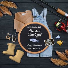 an assortment of fishing related items including overalls, socks, and boots on a wooden surface