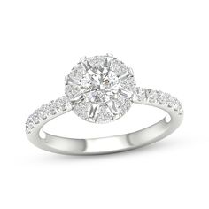 a white gold engagement ring with round diamonds