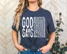 a woman wearing a t - shirt with the words god savers printed on it