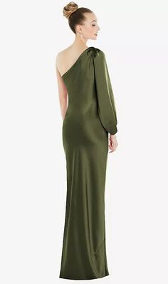 a woman in a long green dress with one shoulder and an asymmetrical neckline