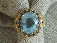 Beautiful 14 kt yellow gold , Stamped 14kt, statement ring set with genuine aquamarine and sapphires. Oval cut aquamarine, set in clasps, surrounded by 16 sapphires, also set in clasps. Aquamarine is clear blue, good color. Sapphires medium- mid blue good color.  Aquamarine is 4.30 carats (approx) Total wt of ring - 7.6 gr, Will fit a size 7 ring finger. Very nice condition Vintage Diamond Rings, Pearl Choker Necklace, Sapphire Diamond Ring, Natural Sapphire, Pink Pearl, Sapphire Diamond, Vintage Diamond, Clear Rhinestones, Glass Jewelry