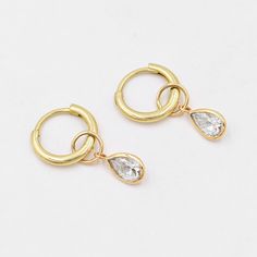 Moissanite charms for earrings (Pair) ✪Gemstone: Natural Moissanite  ✪Metal: 18k solid yellow gold. ✪Stone size: 6x4 mm. ✪Stone Shape : Pear ✪Stone Weight : 0.78 Ct. ✪ Charm Weight : 0.460 Gram ✪Charm + Hoop Weight : 1.460 Gram Approx. ✪Charm Length : 13 mm. ✪Charm width : 5 mm. ✪Bail size inside : 4 mm. ✪Fit Up To 3.5 mm Wide Hoops. ✪Hoop Size inside : 8 mm. ✪Hoop Width : 1.5 mm ✪Setting type: Bezel wire setting. If you need any other preferred stone please contact us. Benefits of Moissanite Gemstones Moissanites are crucial in physical healing. ... This gemstone is also known to improve communication between couples and close family members. ... Moissanite gemstones also enable the wearer to connect with their inner spirituality better.   QUALITY OF MATERIALS: Metal: Most of our jewelry Teardrop Cubic Zirconia Huggie Earrings, Anniversary Gold Plated Teardrop Huggie Earrings, Anniversary Teardrop Gold-plated Huggie Earrings, Anniversary Teardrop Gold Plated Huggie Earrings, Anniversary Teardrop Cubic Zirconia Huggie Earrings, Gold Teardrop Huggie Earrings In Cubic Zirconia, Gold Teardrop Huggie Earrings With Cubic Zirconia, Drop Hoop Earrings For Anniversary, Anniversary Drop Hoop Earrings Tarnish Resistant