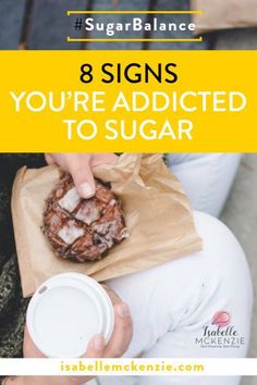 a person holding a doughnut in their hand with the text 8 signs you're addicted to sugar