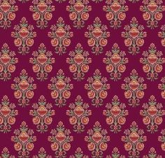 a red and green floral pattern on a purple background