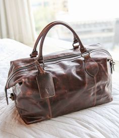 Cognac:Frye Logan Overnight Bag Travel Brown Bags With Gunmetal Hardware, Brown Satchel With Gunmetal Hardware For Travel, Travel Satchel In Distressed Brown, Distressed Brown Crossbody Travel Bag, Leather Weekender, Leather Duffle Bag, Leather Duffle, Mens Lifestyle, Overnight Bag