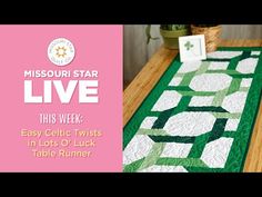 a table with a green and white quilt on it