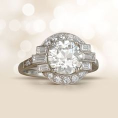 a white diamond ring with baguetts and diamonds on it