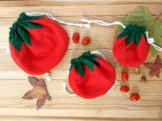 two red tomatoes with green leaves and candy on the side, next to each other