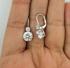 𝐃𝐞𝐬𝐜𝐫𝐢𝐩𝐭𝐢𝐨𝐧 : *4.41TCW Round Cut Moissanite Diamond Drop Earring, 10K Gold Two Stone Earring, Lever Back Dangle Drop Earring, Woman's Wedding Gift Earring. ❖ 𝐃𝐢𝐚𝐦𝐨𝐧𝐝 𝐃𝐞𝐭𝐚𝐢𝐥𝐬 *Color : White *Clarity : VVS *Cut : Excellent *Shape : Round *Stone Size : 3.50, 8.00 MM *Total Carat Weight : 4.41 CT *Type : Cubic Zirconia / Moissanite ( As Per Order ) *Certificate : AGL ASIA (ONLINE) ❖ 𝐄𝐚𝐫𝐫𝐢𝐧𝐠 𝐃𝐞𝐭𝐚𝐢𝐥𝐬 *Length : 19.00 MM *Metal Purity : Solid Gold (10K, 14K, 18K) * Aesthetic Jewellery, Round Diamond Earrings, Jewelry Designing, Nouveau Jewelry, Stone Dangle Earrings, Solitaire Earrings, Moissanite Earrings, Jewellery Ideas, Anniversary Gifts For Wife