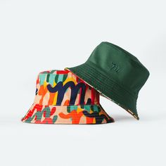 Green/ Million M Pattern Mid-weight reversible Bucket hat with a solid color Side and the MIFLAND Million M's Print on the other side One Size Fits All - Fits from 7-73/4 (Hats Sizes) Reversible 5-panel Hat One Size Fits Most, Reversible 5-panel Hats, Reversible 5-panel Hat One Size, Reversible One Size Fits Most 5-panel Hat, Green Reversible Sun Hat With Curved Brim, Green Reversible Short Brim Bucket Hat, Green Reversible Curved Brim Bucket Hat, Reversible Bucket Hat For Outdoor, Green Reversible Bucket Hat With Curved Brim