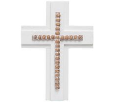 a white cross with beads hanging from it