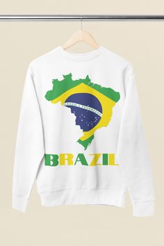 Celebrate the vibrant culture of Brazil with this Brazilian flag sweatshirt featuring a detailed map of Brazil! Ideal for fans of Brazilian samba, Rio de Janeiro, Sao Paulo, and those who love Brazilian recipes or the Portuguese language. This cute Brazil shirt is perfect for showing off your Brazilian pride, whether you’re traveling, learning Brazilian embroidery, or just want a stylish airport outfit. Don't miss out on this cozy Brazil crewneck—it's a must-have for anyone passionate about Brazil. Get your Brazil map print sweatshirt today and bring a piece of Brazil into your wardrobe! White Long Sleeve Sweatshirt With Front Print, Multicolor Crew Neck Sweatshirt With Screen Print, Brazil Shirt, Brazil Map, Custom Crewneck Sweatshirts