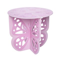 a pink butterfly shaped table with holes in the center and cut outs on the sides