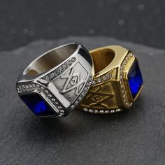 Unleash the power of the Master Mason Blue Lodge Ring! Crafted from high-quality silver stainless steel and adorned with a beautiful blue gemstone, this ring exudes elegance and sophistication. Make a statement that reflects your passion and dedication to your craft. Elevate your style and showcase your pride with this stunning and symbolic piece.We ship worldwide to 185 countries! Please allow 1-2 business weeks for your order to arrive. Blue Metal Jewelry For Anniversary, Blue Large Stone Ring Jewelry, Elegant Blue Metal Rings, Formal Blue Jewelry With Large Stone, Formal Blue Metal Jewelry, Blue Metal Ring As Gift, Blue Metal Rings As A Gift, Adjustable Blue Ring With Polished Finish, Blue Sapphire Jewelry With Polished Finish