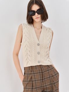 MO&Co. Women's Cropped Cable Knit Vest Features : - Deep V neckline - Flower-shaped diamond buttonsCode : MBB3CAR001Length of size M is 46.5cmApricot : Model is 179cm tall and wearing a size M MATERIALS & CARE : Material : 51% Wool 49% PolypropyleneDo not wash, do not bleach Spread out in the shade to dry, do not tumble dry Iron at low temperature, professional dry cleaningTips : Wrap buttons before dry cleaningPlease select your own size in the size chart according to your figure and serve mode Vest Knit, Cable Knit Vest, Knit Projects, Knitted Vest, Knit Vest, Deep V, V Neckline, Women Crop, Apricot