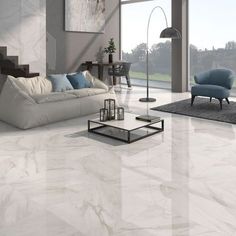 a living room with white marble floors and furniture