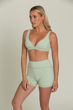 Our Pastel Green Bralette will be your go-to for everyday comfort. This plunging V-cut neckline bralette features removable padding for customizable support and is hardware-free for a seamless fit. Crafted from buttery soft fabric, it offers a luxurious feel against your skin. Perfect for lounging or layering, this comfortable and stylish bralette will quickly become a staple in your wardrobe. Solid Color Low-cut Sports Bra With Removable Pads, Chic Sports Bra With Built-in Bra For Workout, Chic Workout Sports Bra With Built-in Bra, Low-cut Sports Bra For Loungewear, Low-cut Fitted Sports Bra For Loungewear, Fitted Low-cut Sports Bra For Loungewear, Sculpting Sports Bra With Bra-friendly Design, Summer Seamless Triangle Top Nursing Bra, Seamless Triangle Top Nursing Bra For Summer