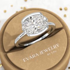 This stunning 3 carat oval half bezel set engagement ring features an oval cut lab grown diamond in a choice of 14K or 18K yellow gold. With its minimal design, this dainty ring is perfect for a proposal. It's a truly unique and elegant choice for your special someone.𝐅𝐞𝐚𝐭𝐮𝐫𝐞𝐬:• 𝐌𝐚𝐝𝐞 𝐭𝐨 𝐎𝐫𝐝𝐞𝐫• 𝐌𝐞𝐭𝐚𝐥: 𝟏𝟒𝐊 𝐆𝐨𝐥𝐝 | 𝟏𝟖𝐊 𝐆𝐨𝐥𝐝 | 𝟗𝟓𝟎 𝐏𝐥𝐚𝐭𝐢𝐧𝐮𝐦 • 𝐁𝐚𝐧𝐝 𝐂𝐨𝐥𝐨𝐫𝐬: Rose Gold, Yellow Gold & White Gold• 𝐁𝐚𝐧𝐝 𝐖𝐢𝐝𝐭𝐡: 1.50 MM• 𝐁𝐚𝐧𝐝 𝐓𝐡𝐢𝐜𝐤𝐧? Oval Diamond Ring In White Gold With Tension Setting, Modern Moissanite Oval Diamond Ring, Minimalist Oval Diamond Ring With Bezel Setting, Modern Oval Wedding Ring With Vvs Clarity, Modern Oval Moissanite Diamond Ring, Modern Oval Diamond Ring With Vs Clarity, Minimalist Oval Cubic Zirconia Wedding Ring, Elegant Oval Diamond Ring With Tension Setting, Oval Diamond Ring For Anniversary