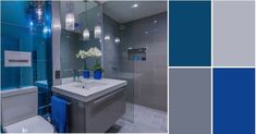 a bathroom with blue and gray colors in it