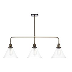 three light chandelier in an antique brass finish with clear glass shades on the bottom