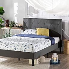 a bed sitting in a bedroom on top of a hard wood floor