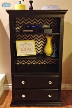 a black bookcase with yellow vases on top