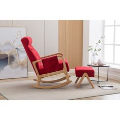 a red rocking chair and ottoman in a living room