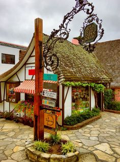 a small building with a sign in front of it