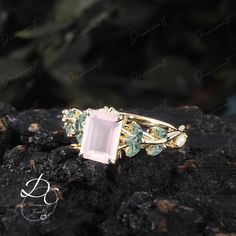 Vintage Emerald Cut Rose Quartz Engagement Ring Nature Inspired Cluster Promise Ring Solid Gold Art Deco Leaf Pink Gemstone Branch Ring --->Ring details: - Theme:Romantic Wedding & Engagement - comfortable band - Center Stone :Rose Quartz - Carat: 6*8mm - Side stone : moss agate +  moissanite - Side stone:0.48ctw - wedding band :Lab opal + moss agate  - 0.12ctw  Materials: - 14k rose gold/14k white gold /14k yellow gold --->Accessories: - beautiful jewelry boxes, and some of little gifts. --->Gu Rose Quartz Ring Engagement, Nature Engagement Ring, Quartz Engagement Ring, Branch Ring, Gold Art Deco, Gold Engraving, Gold Accessories, Gold Art, Pink Gemstones