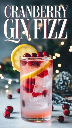 the cranberry gin fizz is garnished with cherries and lemon