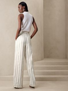 A wardrobe wonder, our designers chose a luxurious cotton-linen fabric for these flowing, wide-leg pants, specially woven with shades of beige and ivory for a striped effect that's ready for warm-weather adventures.  RELAXED WIDE-LEG FIT: High waiste Chic White Wide Leg Pants With Vertical Stripes, Chic Striped Linen Bottoms, Chic Wide Leg Pants With Vertical Stripes For Summer, Elegant White Striped Pants, Striped Wide-leg Linen Pants, Elegant White Pants With Vertical Stripes, Striped Linen Wide-leg Pants, Elegant Striped Wide Leg Pants For Summer, Elegant Striped Linen Bottoms