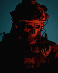 a skeleton wearing a helmet and holding a cell phone in his hand with the british flag on it