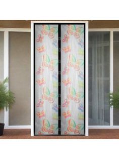 an open sliding glass door with butterflies on the curtain and potted plants in front