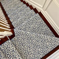 an animal print rug is on the stairs