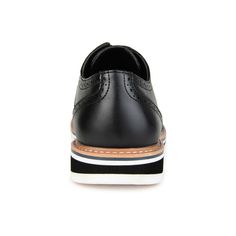 A dress shoe that combines high-style with all-day comfort, the Warrick by Vance Co. A wingtip accent and a contrasting textured design enhanced with brogue details tops this lace-up derby. Smooth vegan leather, a lightweight EVA outsole, and a 4 mm memory foam footbed provide superior support. Black Wingtip Oxfords For Spring, Black Wingtip Dress Shoes With Contrast Sole, Casual Black Dress Shoes With Brogue Detailing, Black Oxfords With Contrast Sole For Spring, Wingtip Oxfords With Contrast Sole For Work, Workwear Wingtip Oxfords With Contrast Sole, Black Wingtip Oxfords For Business Casual, Black Oxford Shoes For Work, Black Wingtip Oxfords With Perforated Toe Box