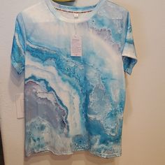 Silky Smooth Blue Marbled Pattern T- Shirt Size L I Cannot Find A Tag Stating What Is Made From. It Is Very Smooth And Slightly Shiny. Has A Good Amount Of Stretch. Blue Crew Neck Blouse For Summer, Blue Crew Neck Top For Beach, Blue Crew Neck Shirt For Vacation, Blue Crew Neck Blouse For Beach, Blue Graphic Print Blouse For Vacation, Blue Relaxed Fit Blouse With Graphic Print, Blue Graphic Print Short Sleeve Blouse, Hand Dyed Blue T-shirt For Summer, Hand Dyed Blue Graphic Tee