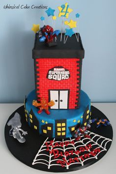 a spiderman themed birthday cake on a table