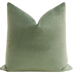 a light green pillow on a white background