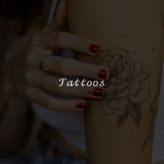 a woman's arm with tattoos on it and the words tattoo written in white