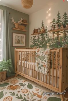 a baby's room decorated in woodland theme