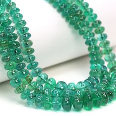 Green Emerald 4mm - 8.5mm Smooth Rondelles 3 Strand Bead Necklace Multi Strand Necklace on an adjustable Fabric Clasp Specifications: Gemstone: Green Emerald  Shape: Smooth Rondelles  Size: 4mm (4mm - 8.5mm) Metal:  Enhance your jewelry collection with our Green Emerald 4mm - 8.5mm Smooth Rondelles 3 Strand Bead Necklace. This stunning piece features three strands of premium emerald beads, smoothly polished to perfection. Ranging in size from 4mm to 8.5mm, these vibrant green emeralds exude luxury and elegance. Perfect for jewelry designers and stores seeking to offer sophisticated, high-quality gemstone necklaces, this piece promises to captivate and delight with its rich color and flawless craftsmanship. Elevate your offerings with this exquisite green emerald bead necklace, a timeless a Multi Strand Beaded Necklace, Emerald Bead, Vibrant Green, Green Emerald, Multi Strand Necklace, Strand Necklace, Multi Strand, New Yorker, Bead Necklace