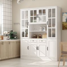 a kitchen with white cabinets and wooden chairs next to a counter top on tile flooring