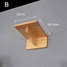 a close up of a wooden shelf with measurements