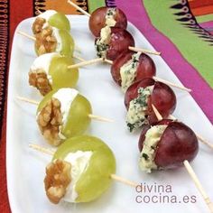 grapes and walnuts are arranged on skewers