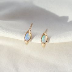 Opal Huggie Hoops | 14k Gold | From Isla Drop Of Water, 14k Gold Hoop Earrings, Iridescent Color, Gold Aesthetic, Ear Stack, Classic Earrings, Crystal Opal, Custom Ring Designs, Custom Earrings