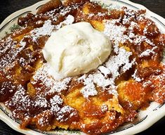 a plate that has some kind of dessert on it with whipped cream in the middle